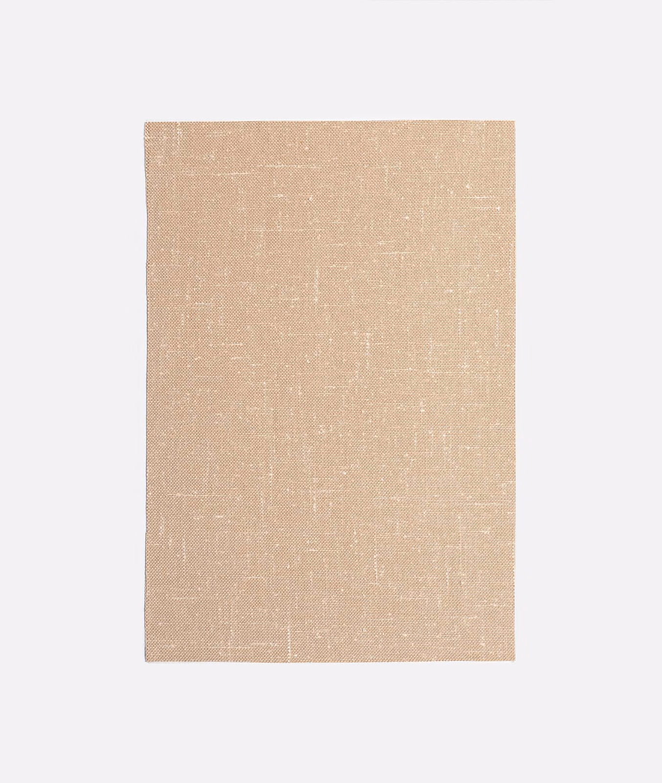 Warm beige woven curtain fabric with subtle irregular flecks and linen-like texture