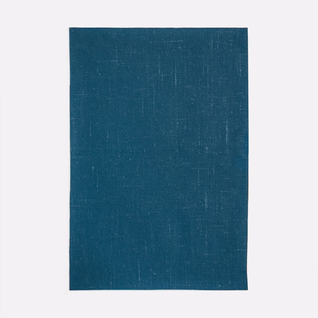 Deep blue-teal curtain fabric with a fine, subtly crosshatched woven surface