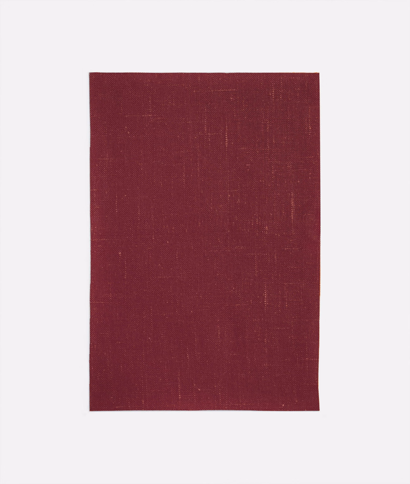 Deep plum-burgundy woven swatch with fine vertical striation and subtle crosshatch texture