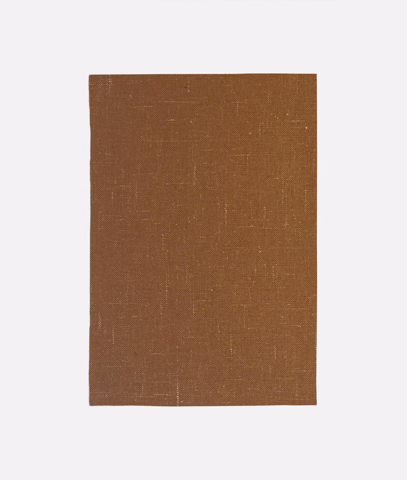 Warm russet-brown curtain fabric with fine crosshatch weave and faint vertical slubs