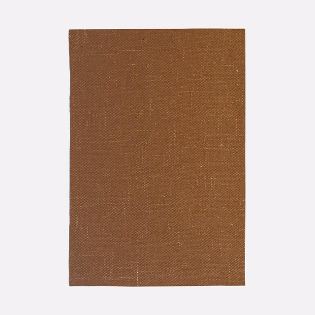 Warm russet-brown curtain fabric with fine crosshatch weave and faint vertical slubs