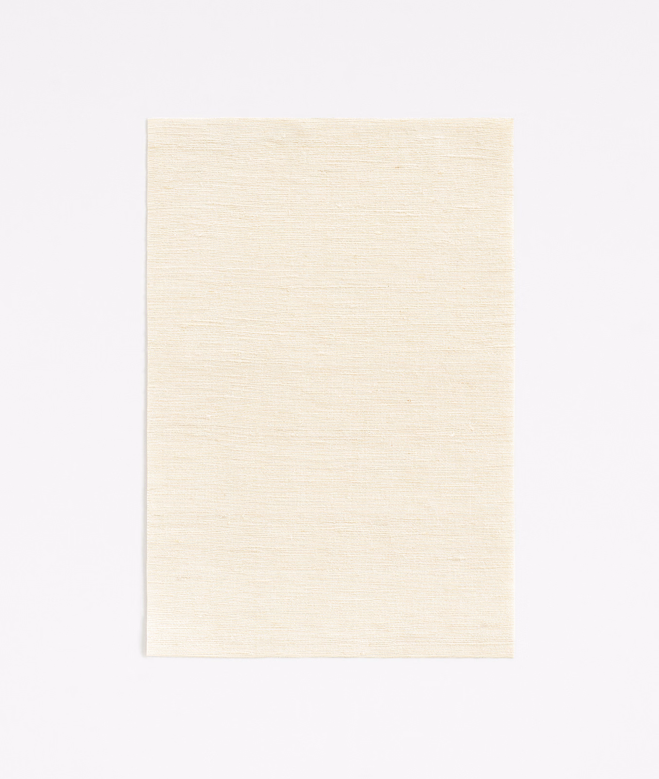Pale ivory Fanfara Albatre swatch showing a fine, subtly slubbed horizontal weave
