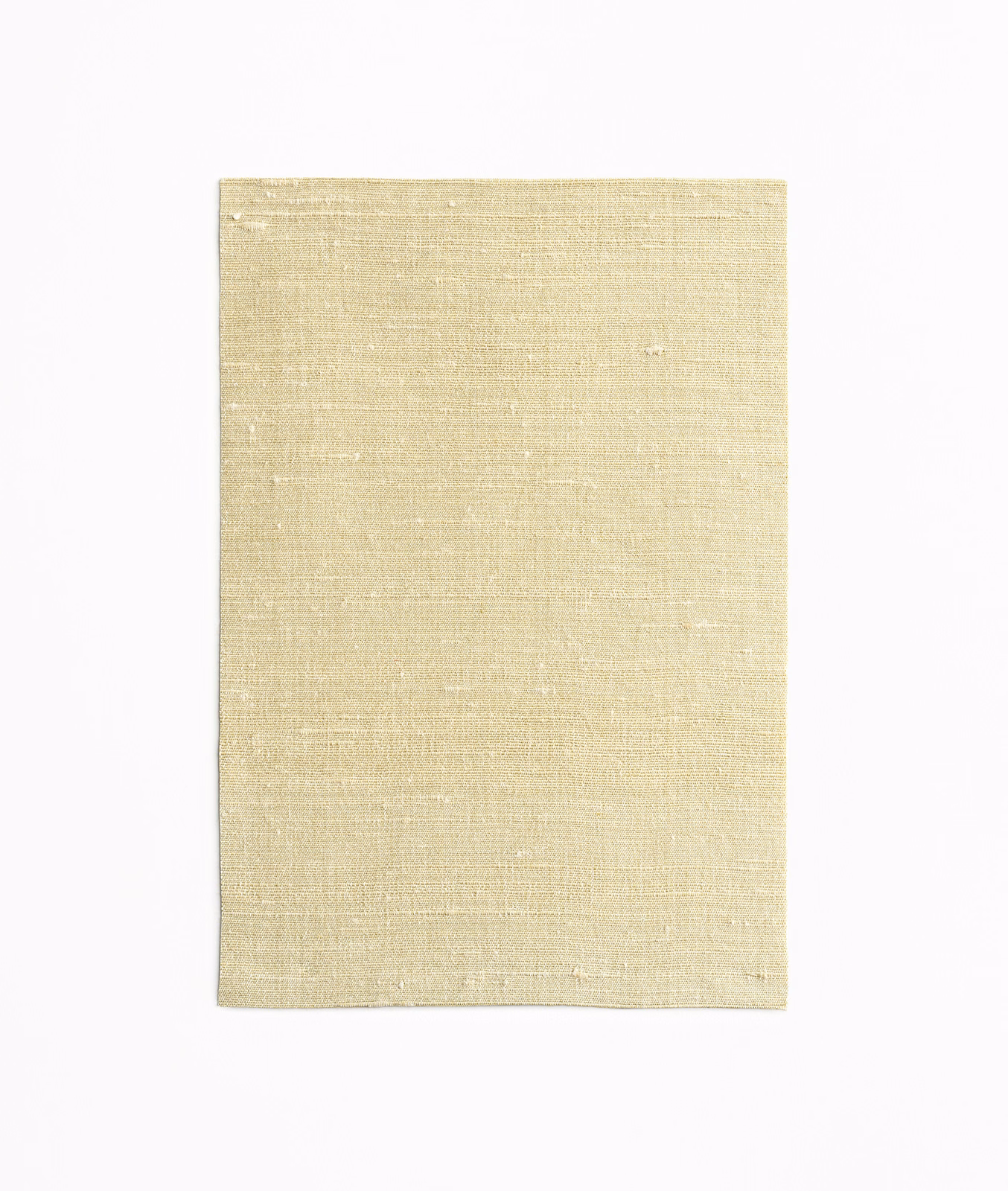 Pale amber fabric swatch with irregular slubbed weave and subtle horizontal texture