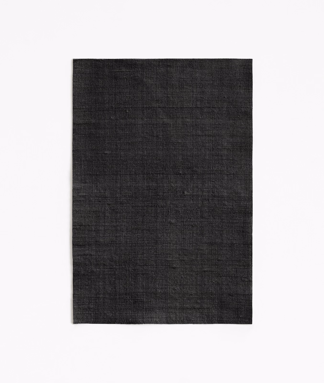 Near-black Fanfara textile with subtle crosswise slubs and a softly textured weave