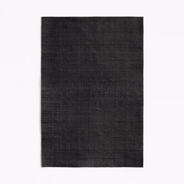 Near-black Fanfara textile with subtle crosswise slubs and a softly textured weave