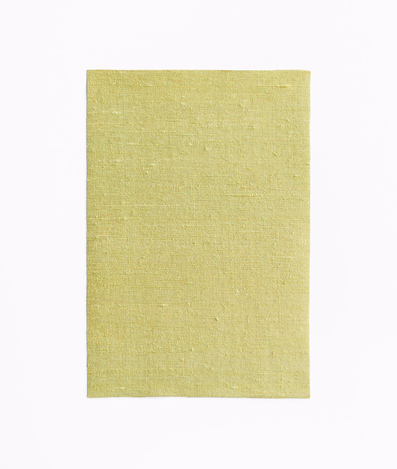 Pale chartreuse-green curtain fabric with subtle slubbed woven texture