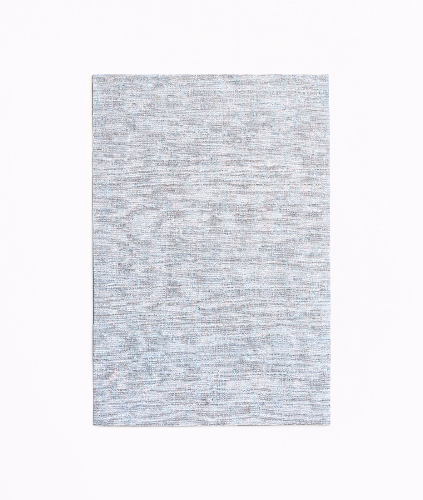 Pale icy-blue woven swatch with fine horizontal texture and subtle tonal variation