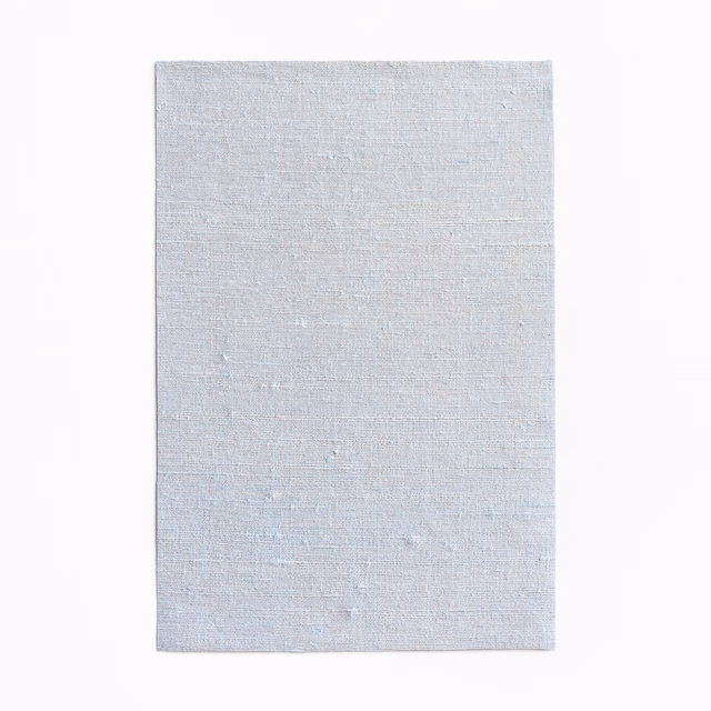 Pale icy-blue woven swatch with fine horizontal texture and subtle tonal variation