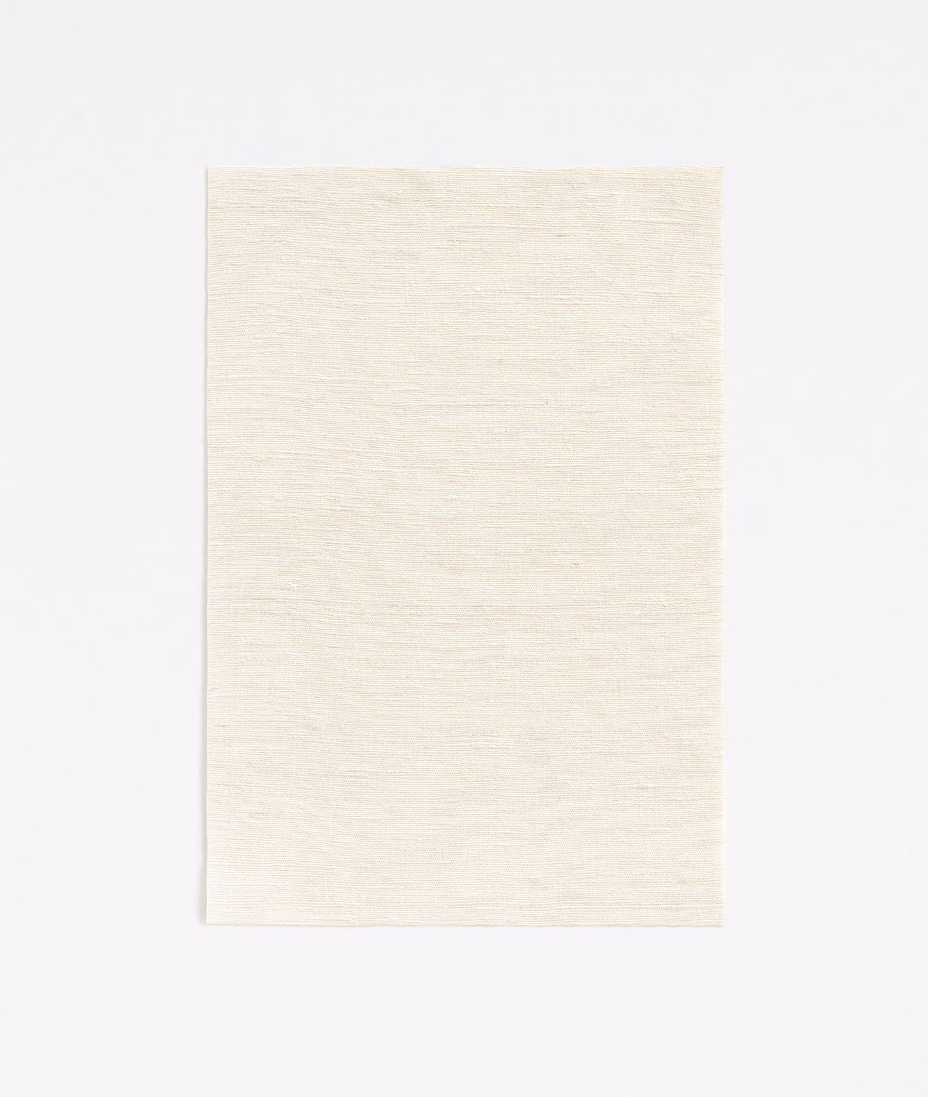 Pale ivory curtain fabric with a fine horizontal woven texture and softly luminous surface