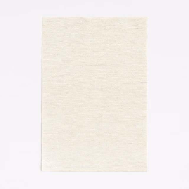 Pale ivory curtain fabric with a fine horizontal woven texture and softly luminous surface