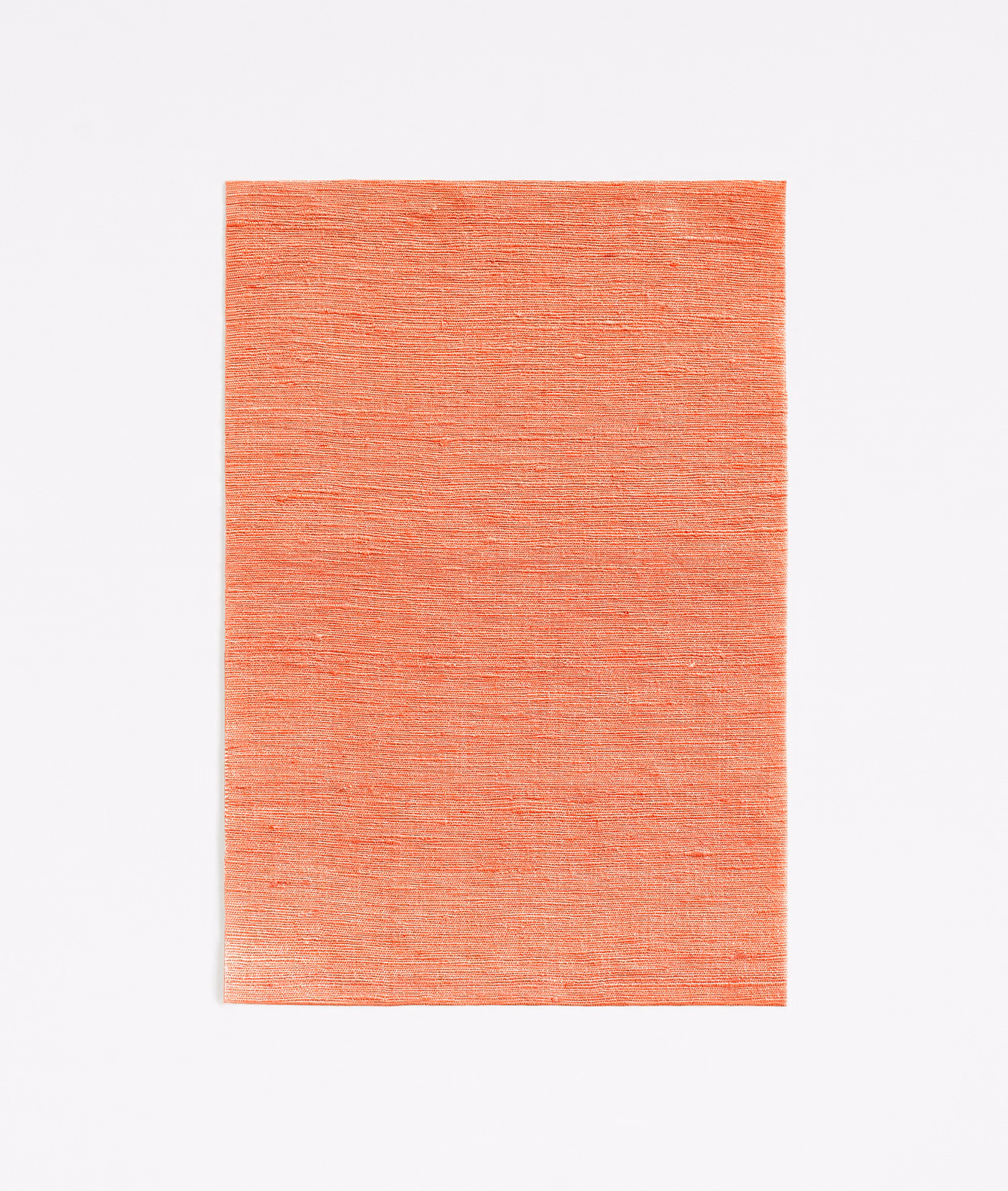 Warm geranium coral fabric swatch with fine horizontal woven texture and tonal variation