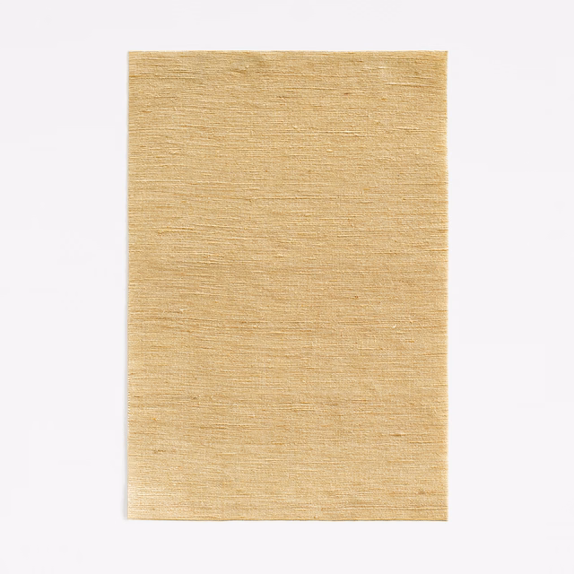 Warm muted gold curtain fabric with fine horizontal woven texture