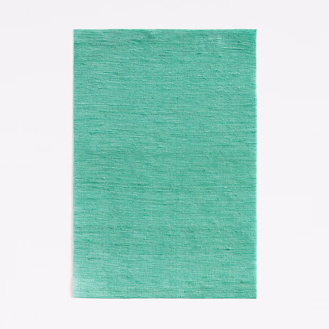 Turquoise malachite-green fabric swatch with fine horizontal slub texture