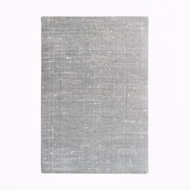 Cool silver-grey curtain fabric with fine horizontal slubbed weave and pale flecks