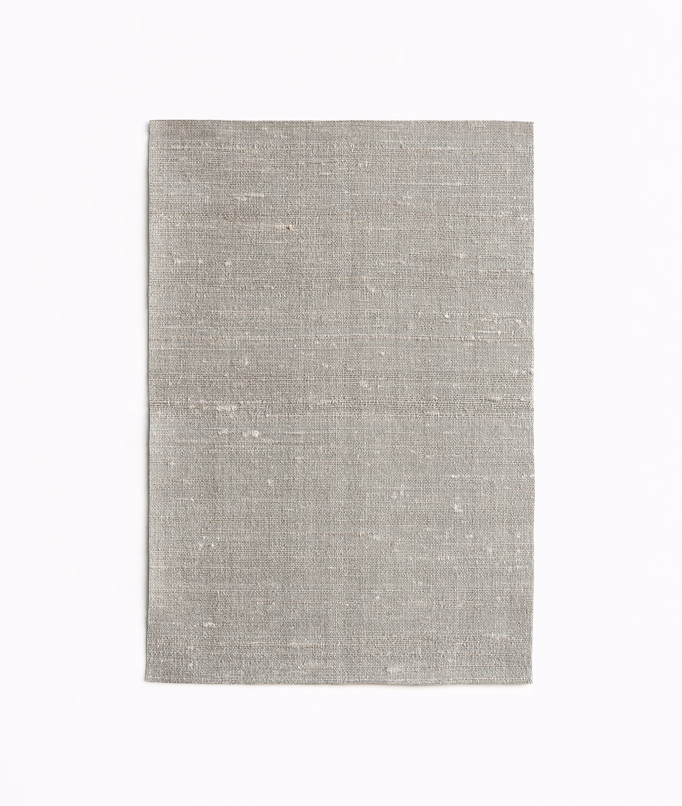 Pale warm-grey Fanfara Mica fabric with fine horizontal woven texture and subtle flecks