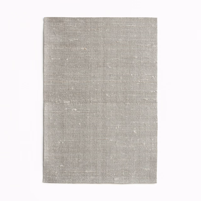 Pale warm-grey Fanfara Mica fabric with fine horizontal woven texture and subtle flecks