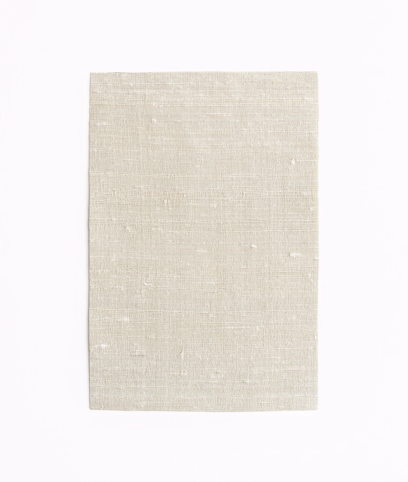 Pale greige woven fabric with fine horizontal texture, subtle slubs and ivory flecks