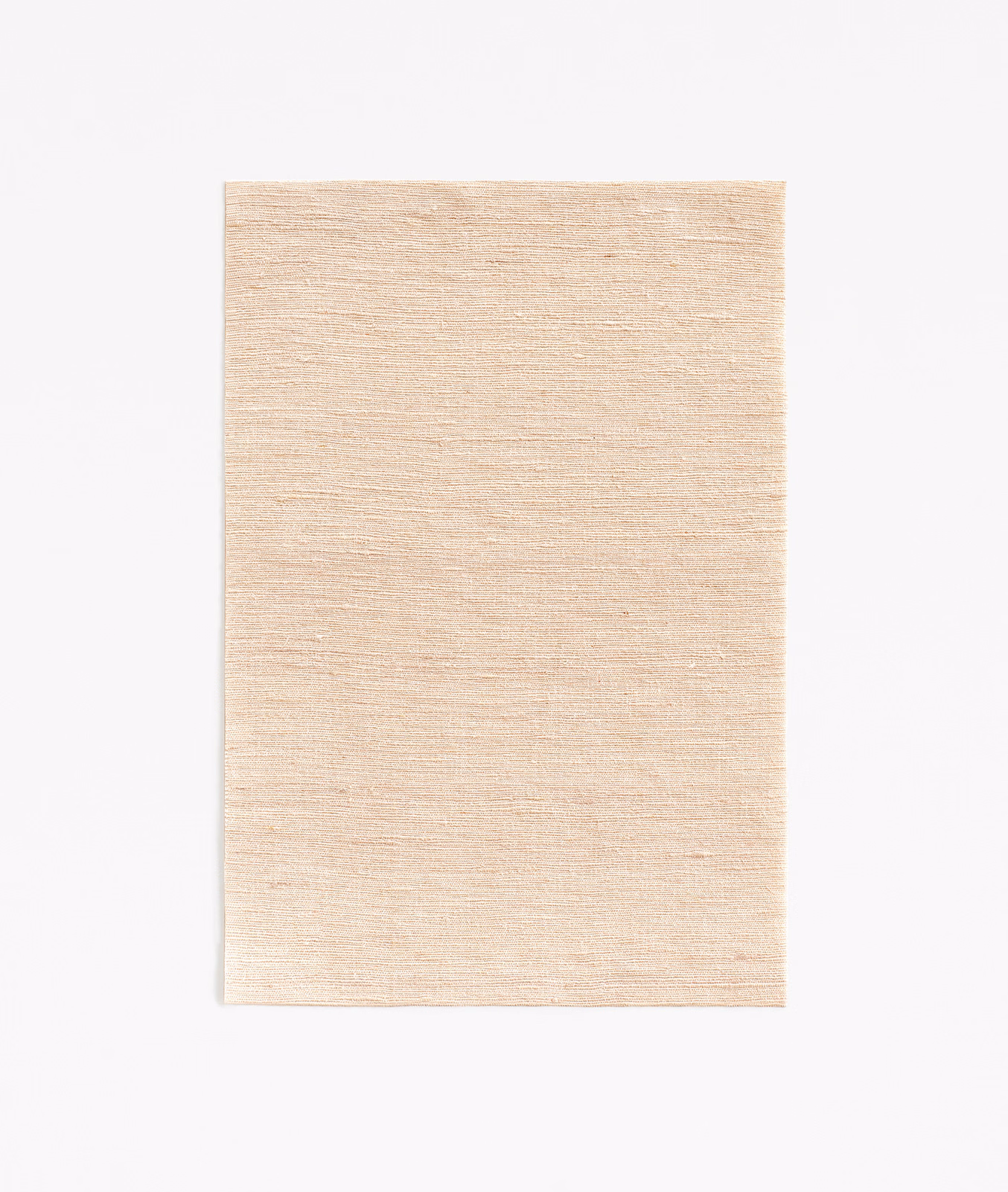 Warm nude beige fabric with fine horizontal slubbing and softly luminous texture
