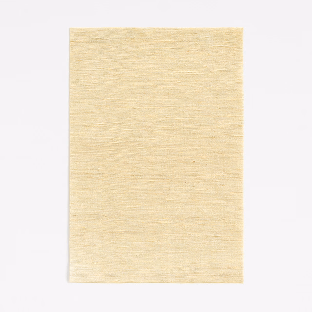 Pale vanilla cream curtain fabric with a fine horizontal slubbed weave