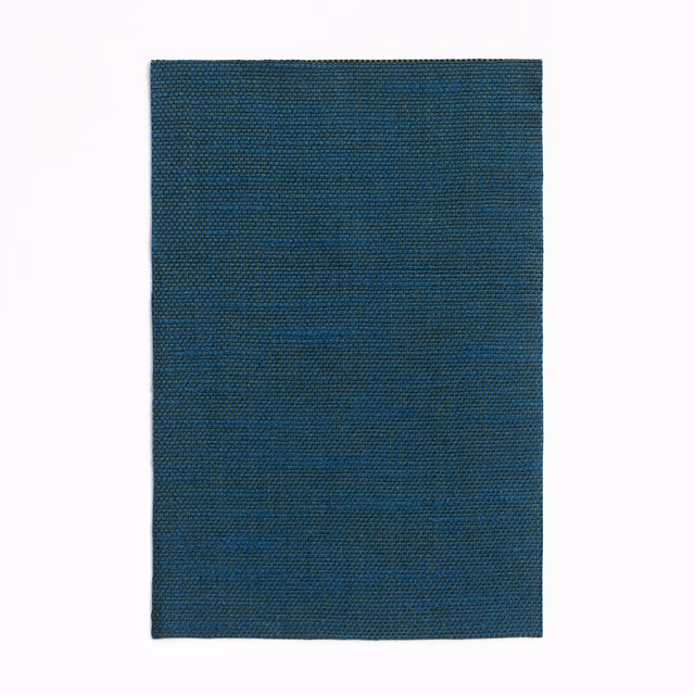 Dark teal-blue swatch showing a fine, closely woven crosshatch and soft tonal variation