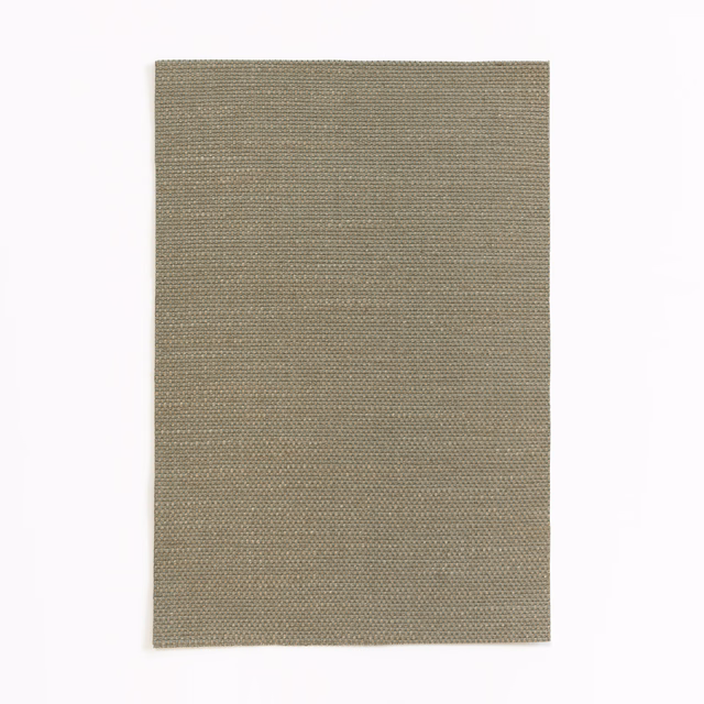 Close-up of warm taupe fabric with a fine, even woven texture