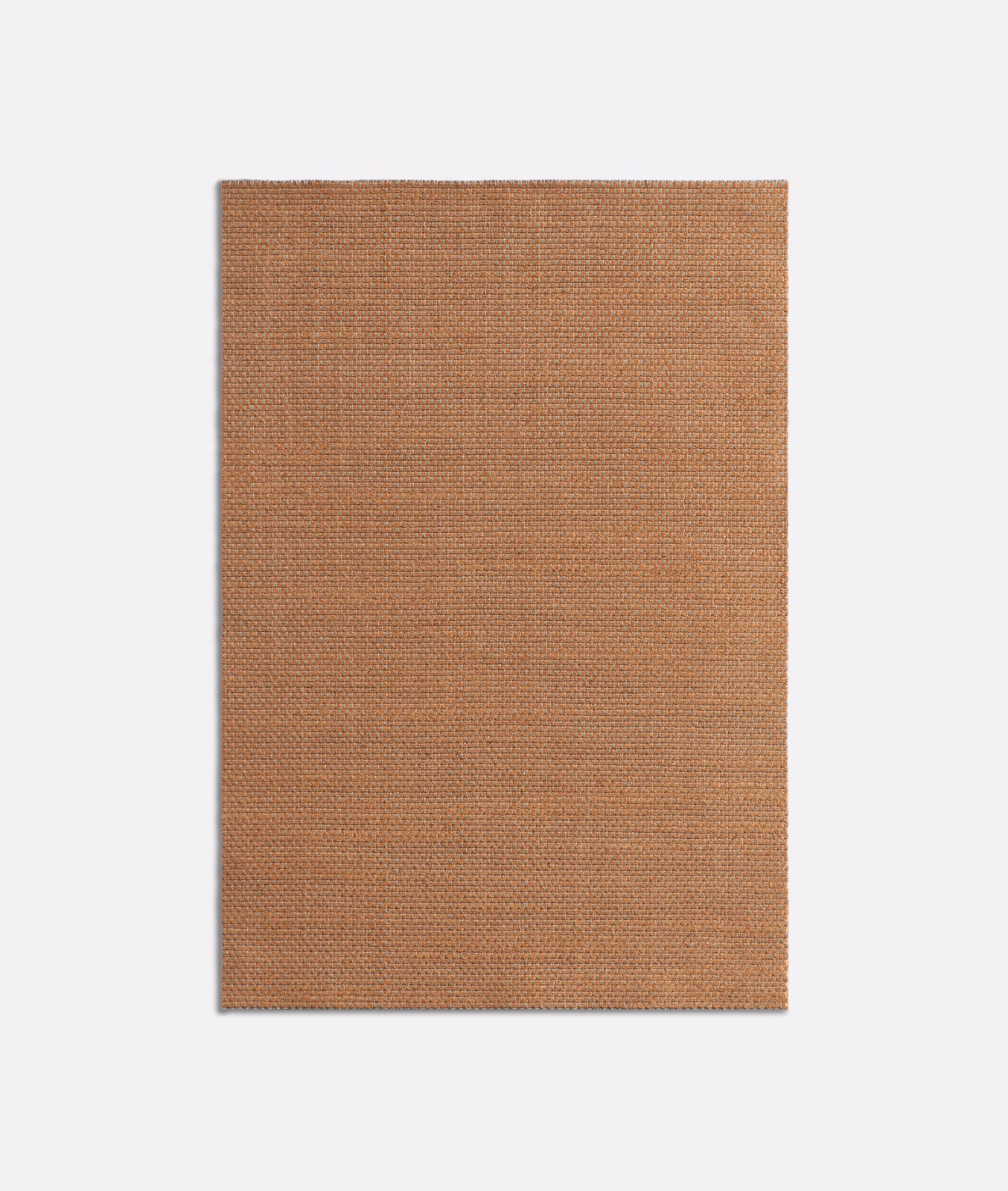 Close-up of warm terracotta fabric with a fine, even woven texture