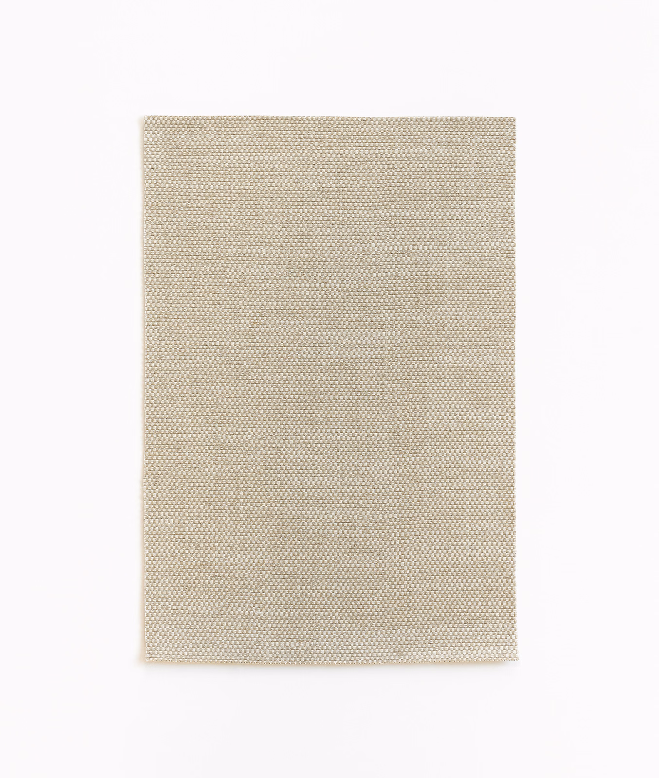 Warm sandy beige curtain fabric with a fine, evenly gridded woven texture