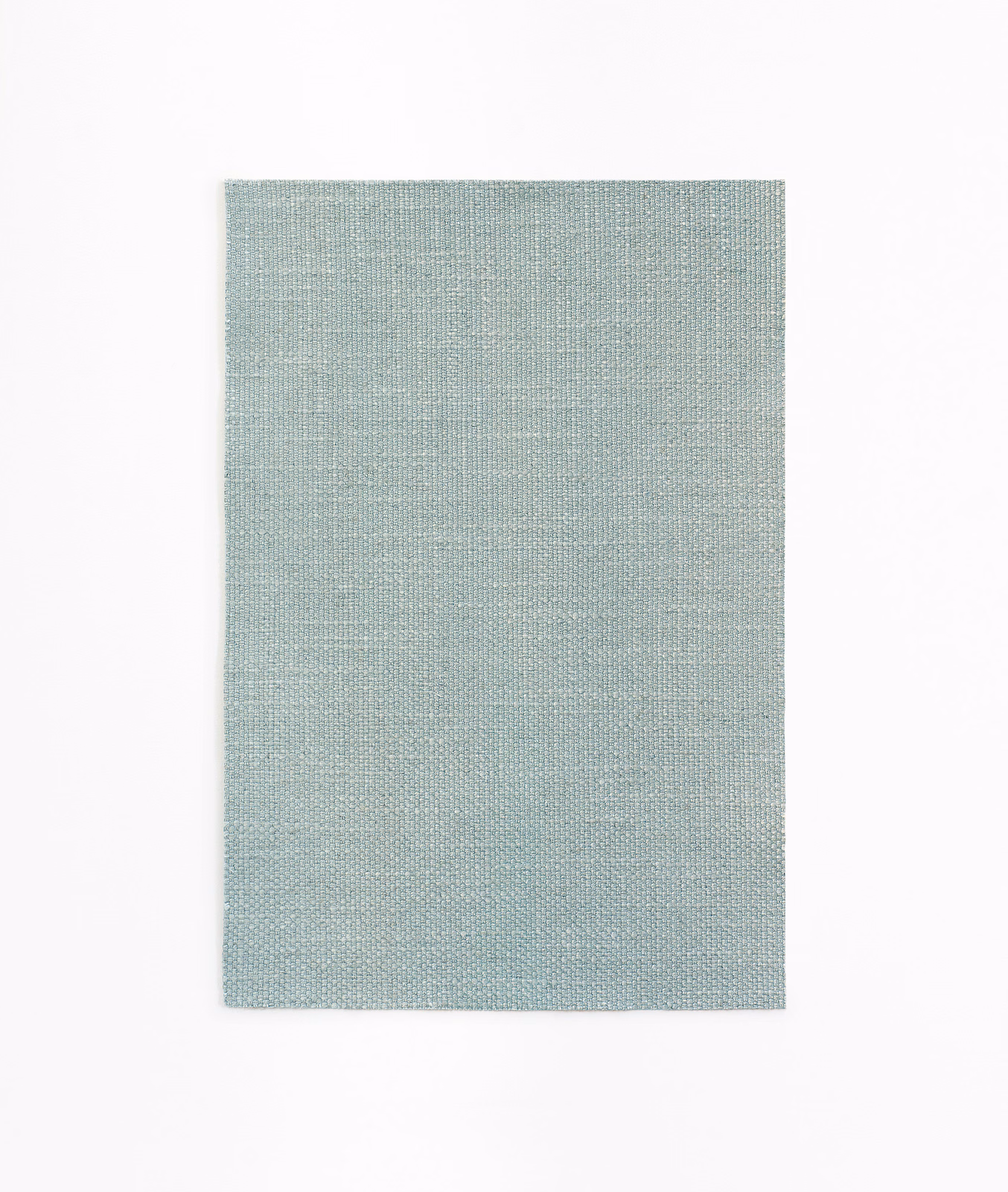 Pale aqua woven curtain fabric showing a fine blue-green crosshatch texture