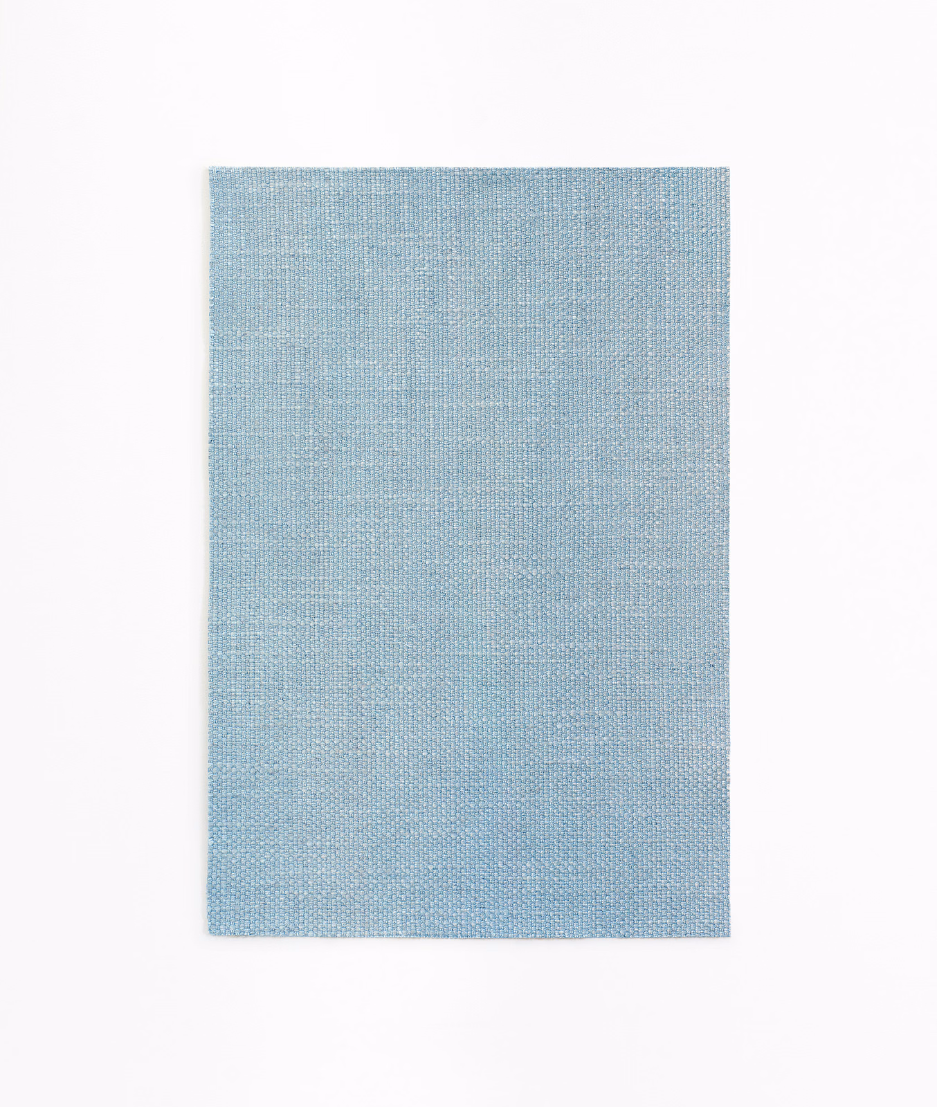 Powder-blue curtain fabric swatch showing a fine, even woven texture
