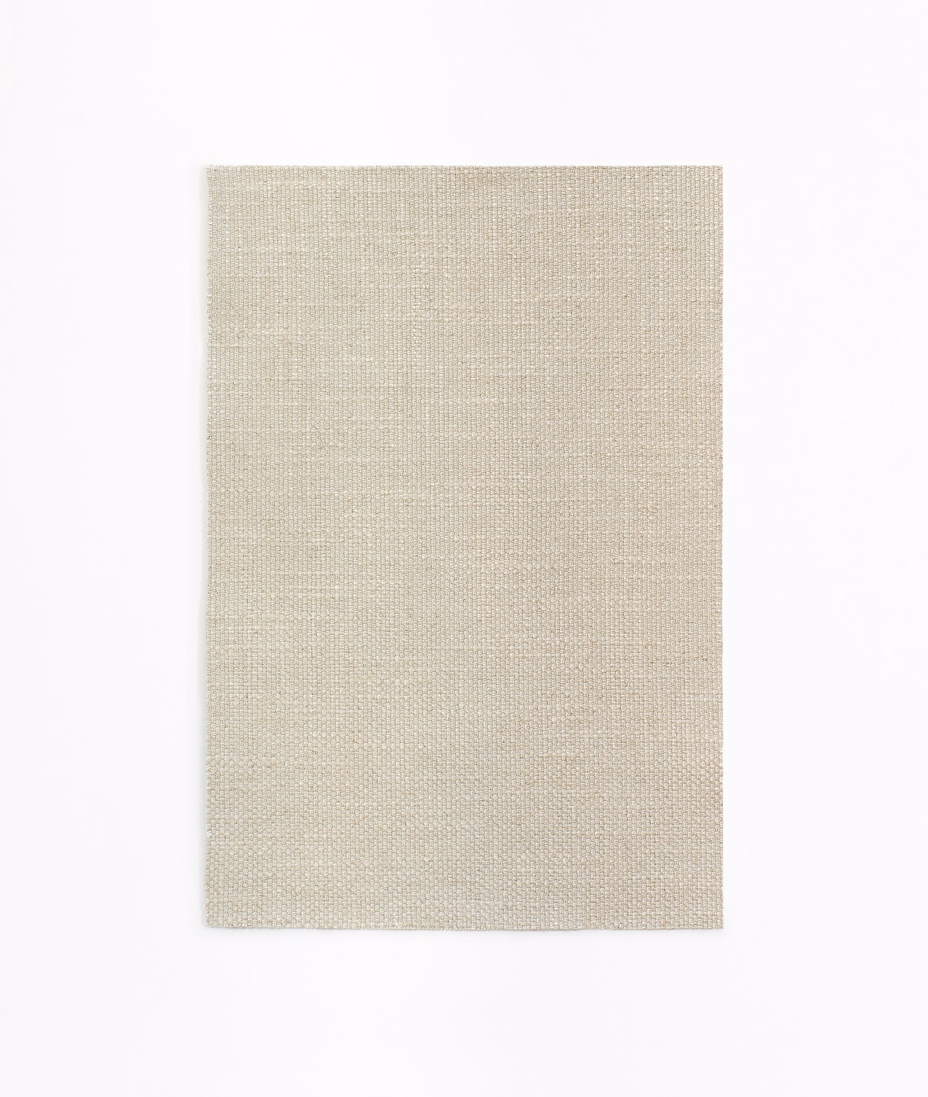 Pale warm beige curtain fabric with a fine, even woven crosshatch texture