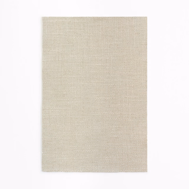 Pale warm beige curtain fabric with a fine, even woven crosshatch texture