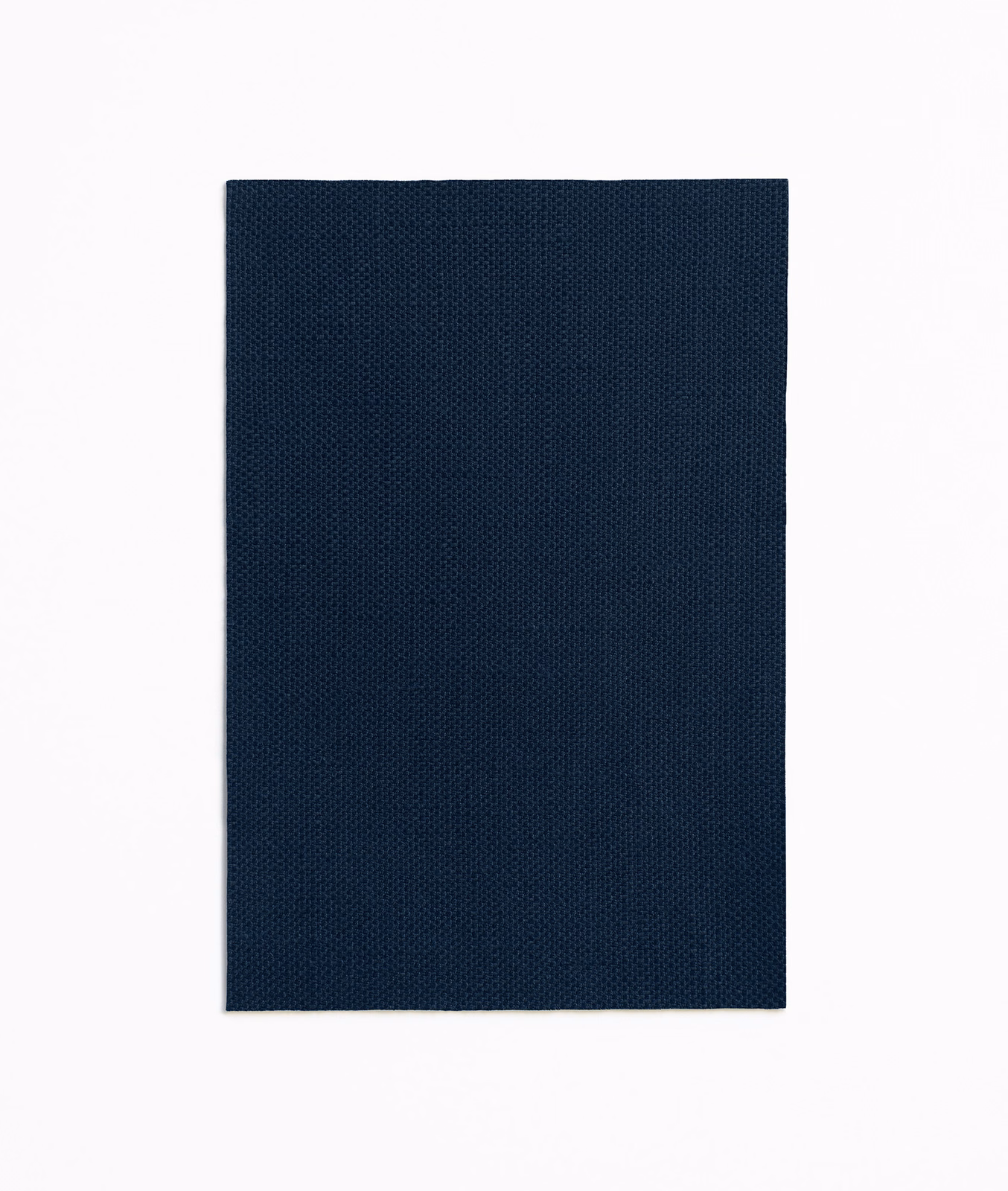 Deep ink-navy plain curtain fabric with a fine, regular woven texture
