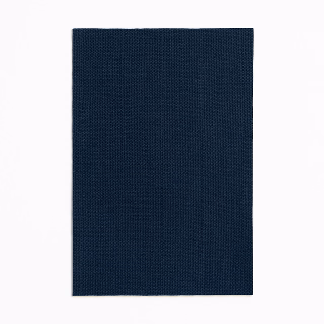 Deep ink-navy plain curtain fabric with a fine, regular woven texture
