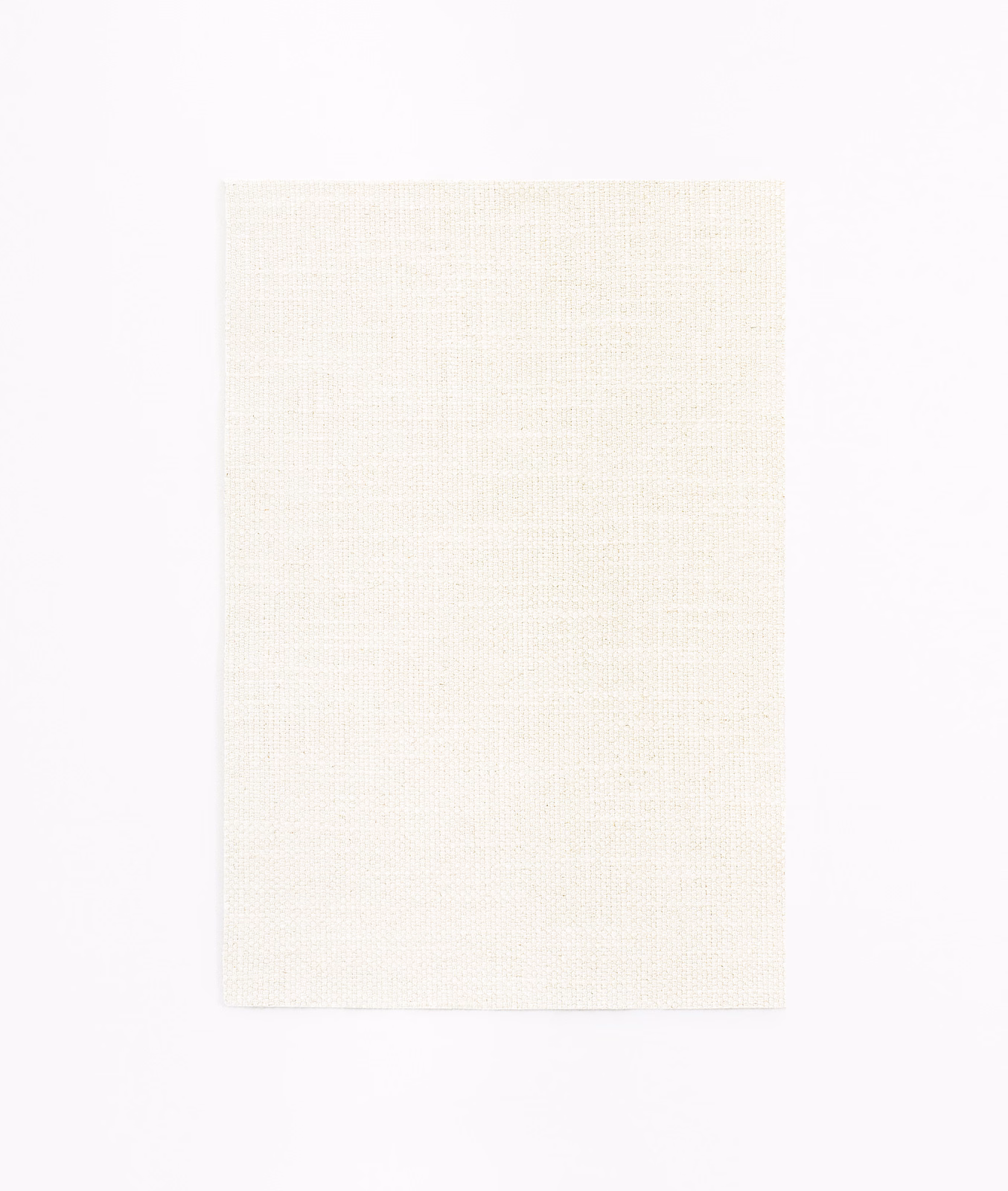 Pale ivory curtain fabric with a fine, subtly textured plain weave