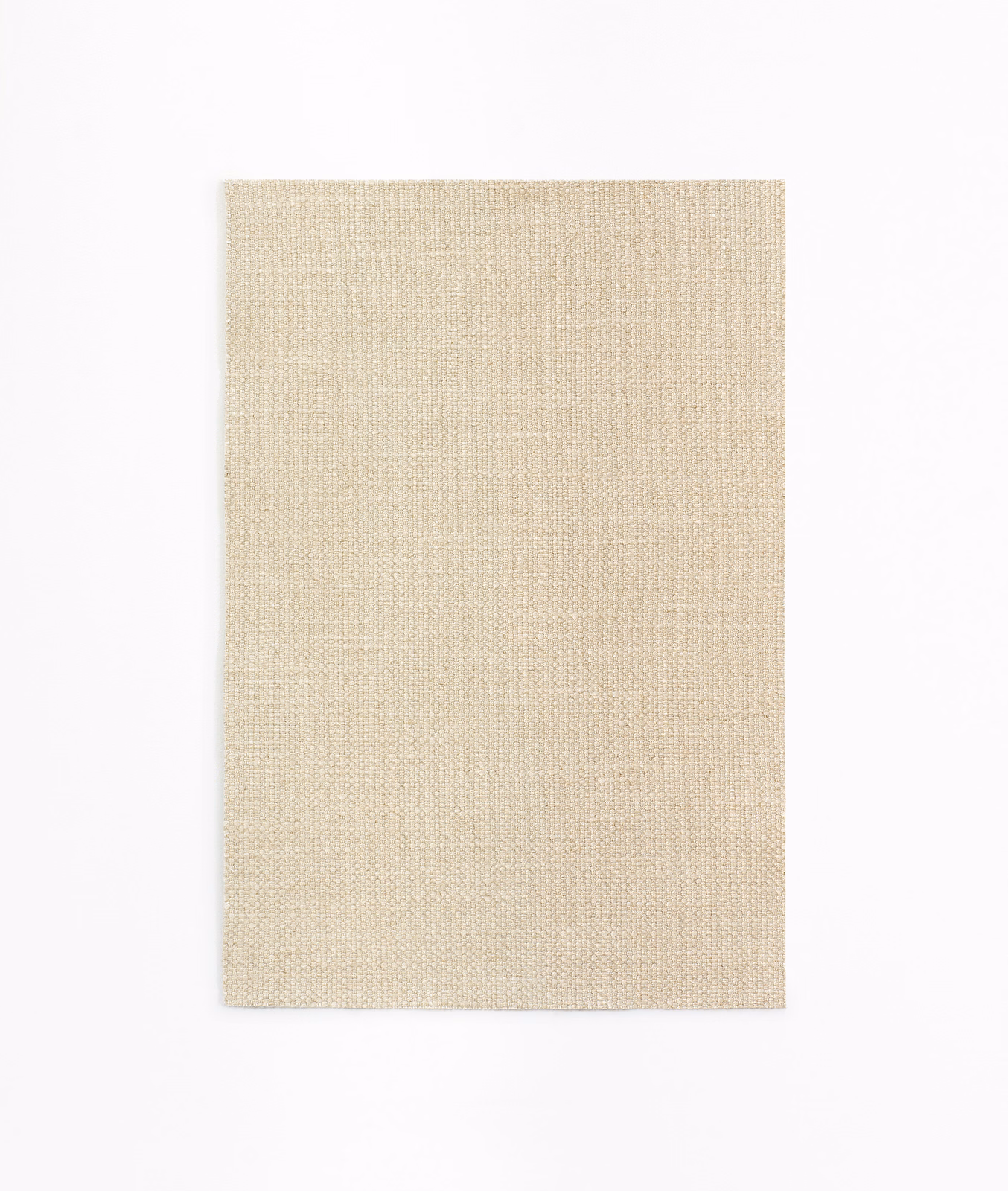 Warm sandy beige curtain fabric with a fine, even woven texture