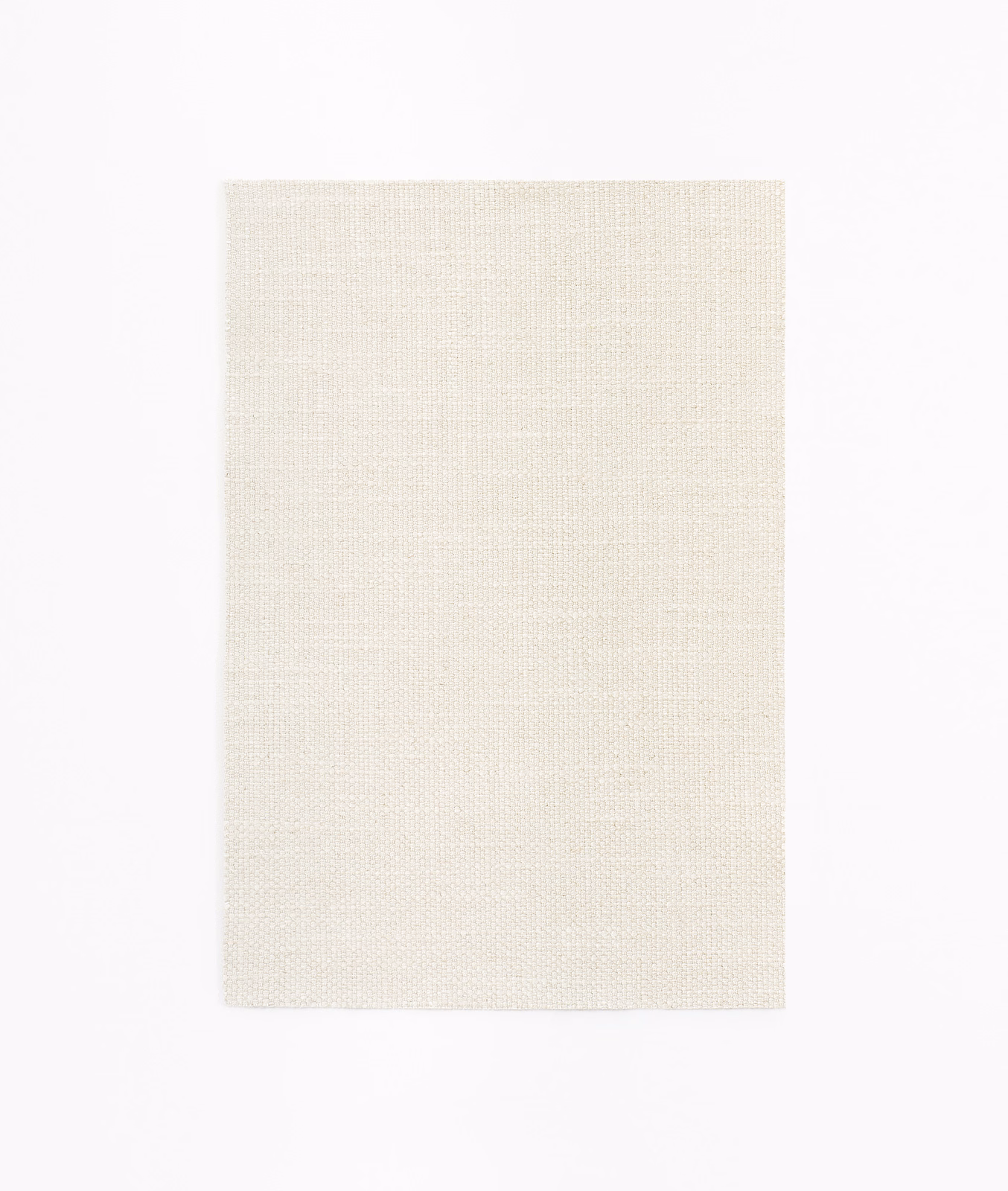Pale ivory cream curtain fabric with a fine, subtly gridded woven texture