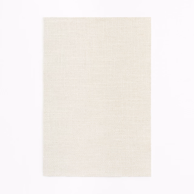Pale ivory cream curtain fabric with a fine, subtly gridded woven texture