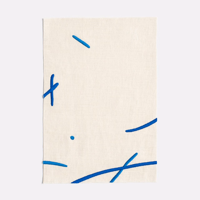 Ivory woven curtain fabric with sparse cobalt-blue abstract strokes and dashes
