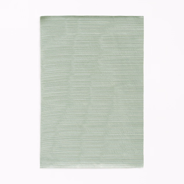 Pale sage-green fabric with fine, softly rippled horizontal striations