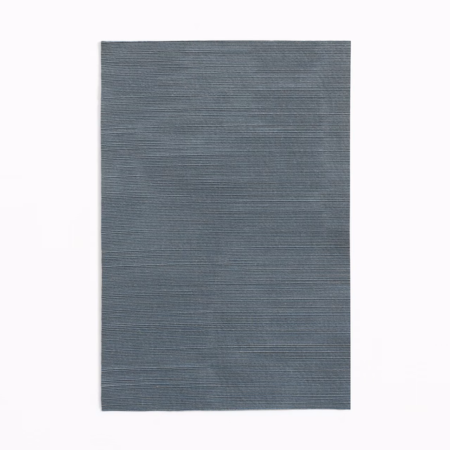 Slate blue-grey textile swatch with fine horizontal striations and subtle woven texture
