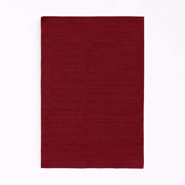 Deep Bordeaux red curtain fabric with fine horizontal ribbing and subtle tonal variation
