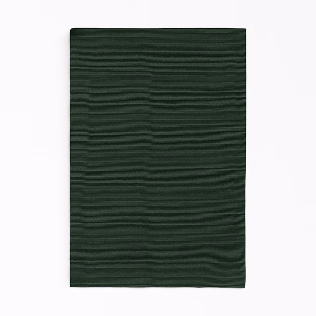 Deep forest-green curtain fabric with fine horizontal ribbing and subtle tonal variation