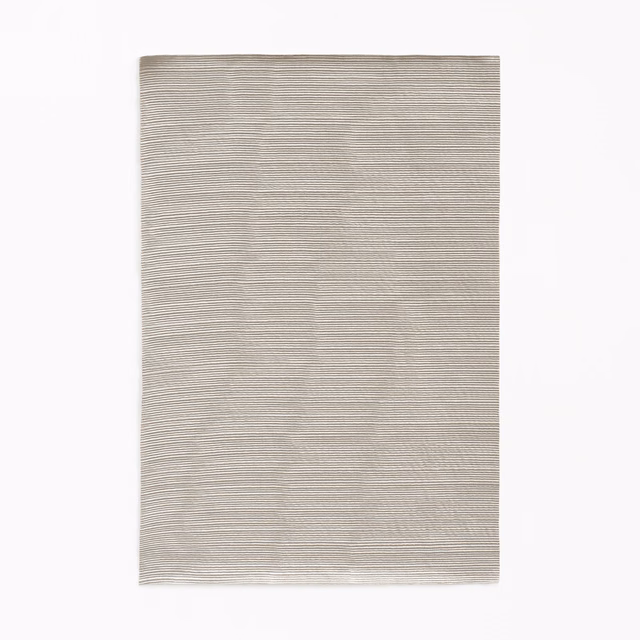 Pale cement-grey fabric swatch with fine, irregular horizontal striations and soft texture