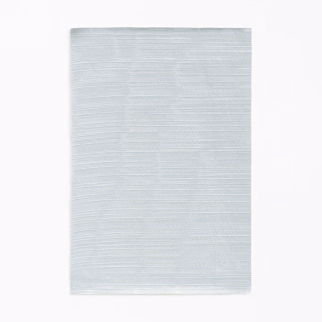 Pale icy blue-grey curtain fabric with closely spaced horizontal striations
