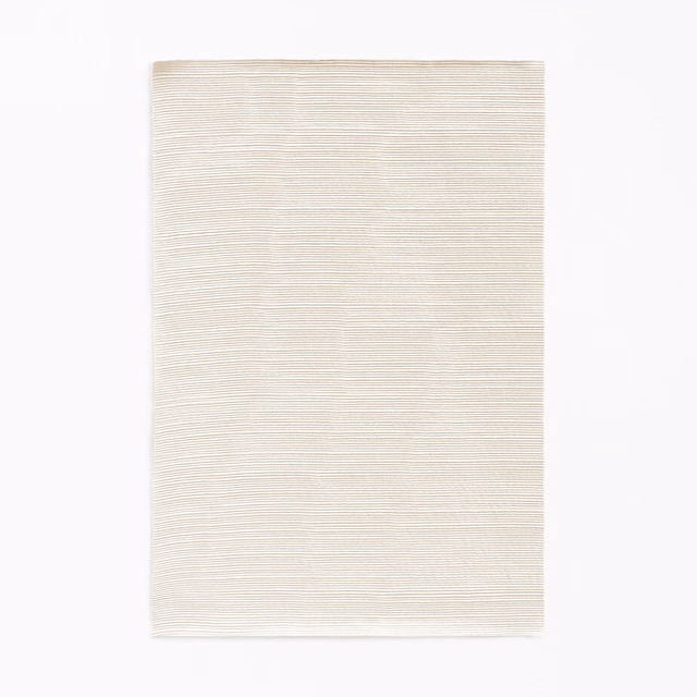 Pale ivory curtain fabric with delicate horizontal striations and natural texture