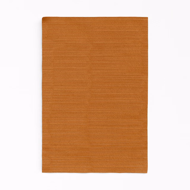 Warm cinnamon-brown fabric with fine horizontal ribbing and a softly varied surface