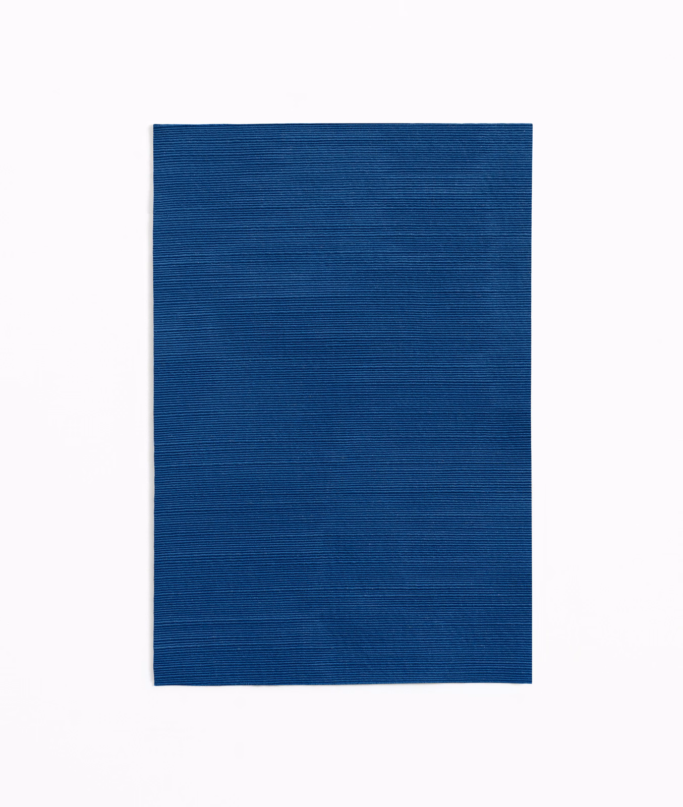 Deep ink-blue curtain fabric swatch with fine horizontal woven texture
