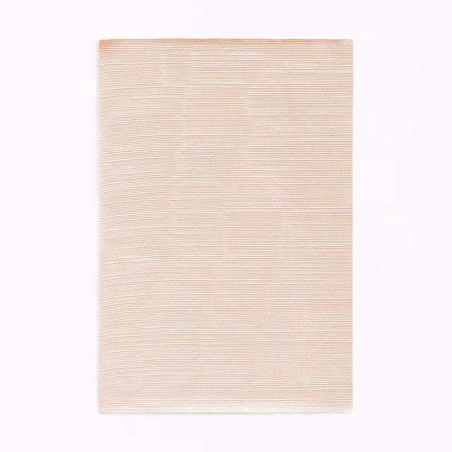 Pale blush-pink curtain fabric swatch with fine horizontal striations and soft sheen