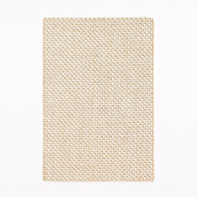 Ivory Dedar curtain fabric with a fine warm-gold geometric woven texture