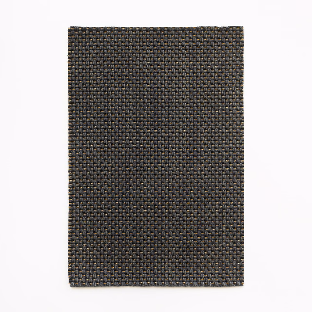 Charcoal-grey curtain fabric with compact basket weave and olive-brown flecks